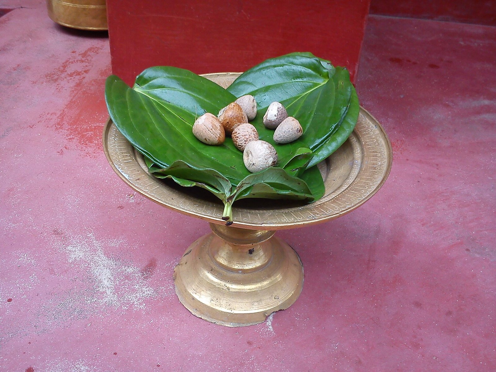 Areca nuts and betel leaves served on a plate