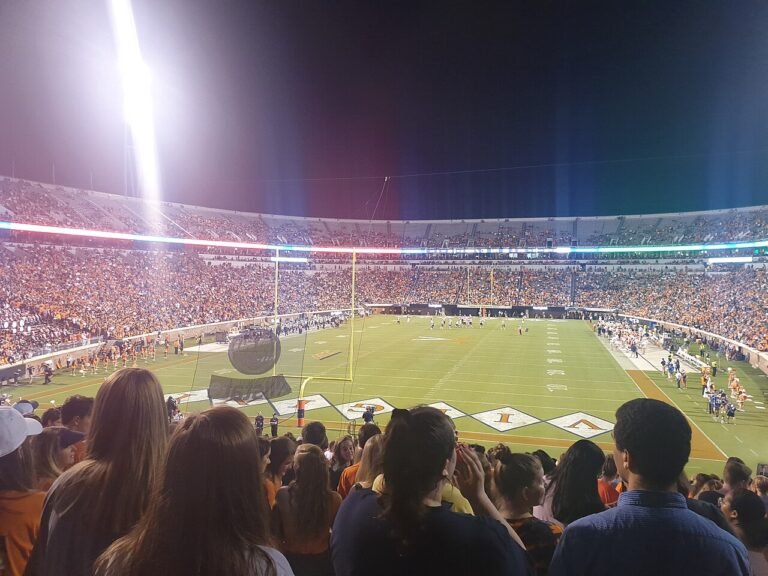 American football game in progress in a stadium