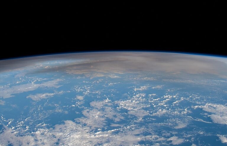 Astronaut photograph of the Hunga Tonga volcanic plume rising over the Pacific Ocean
